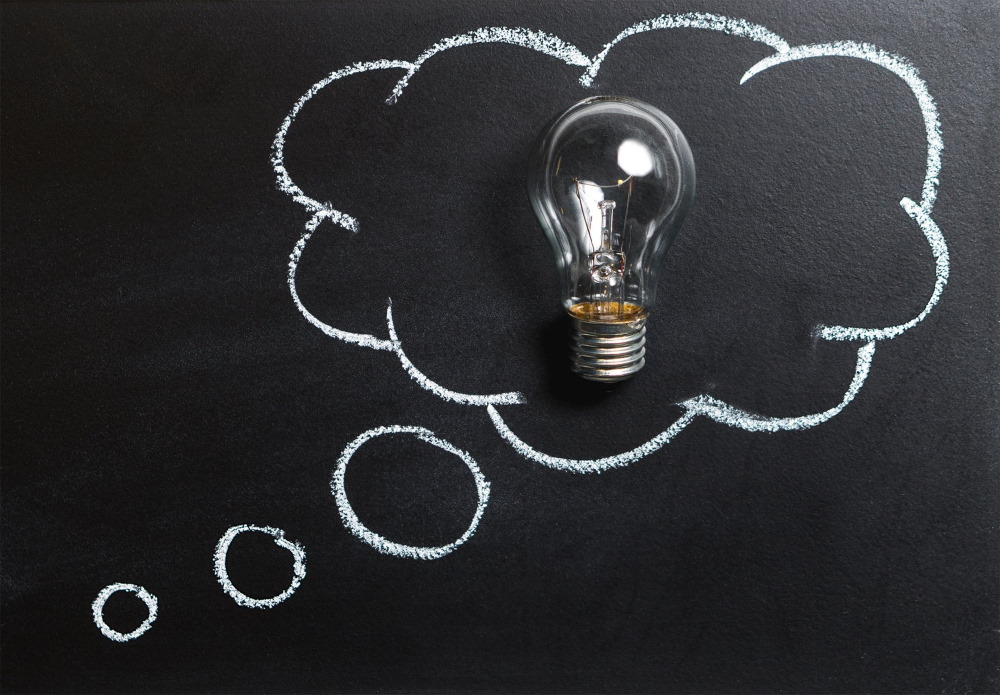 Thought bubble with a light bulb inside.