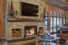 The quality can be seen in the way that textures like the woodwork on the walls contrast with the large stone of the fireplace surround.