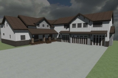 Large farmhouse with gray siding and brown roof.