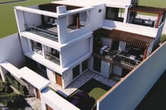 Modern three-story home with clean white lines and a second-floor outdoor seating area