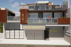 Three-story remodel with an outdoor cafe seating area and a second and third-story balcony.